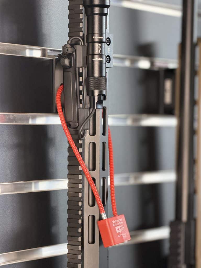 Lockable STEALTH M-LOK rifle mount securing a rifle